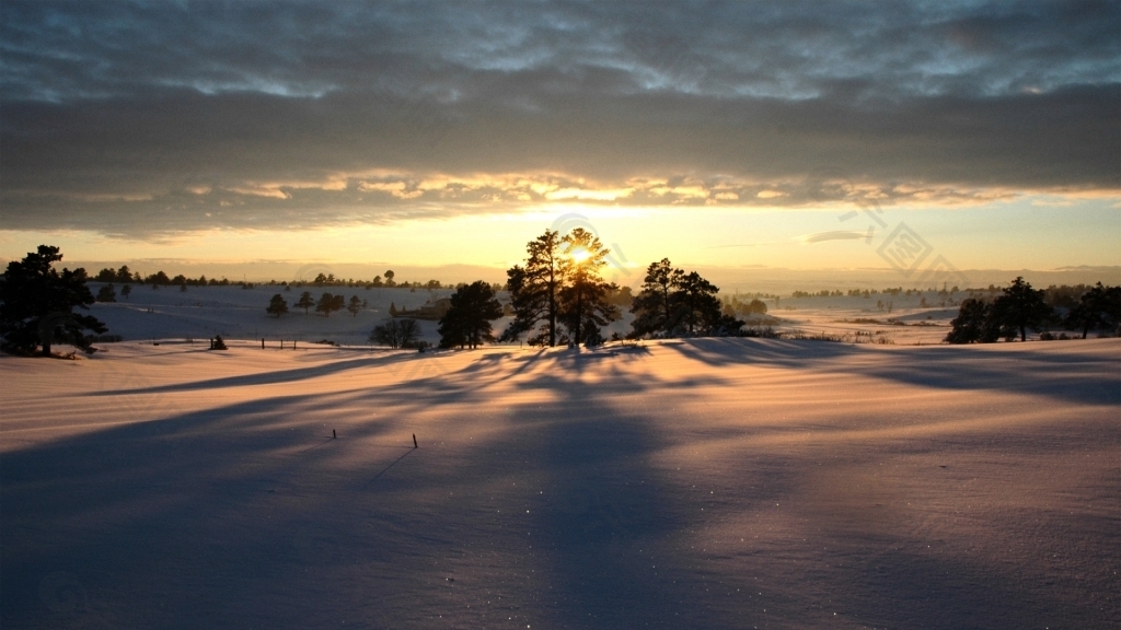 夕阳落日雪地风景背景素材图