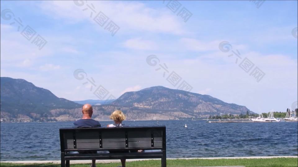 坐在湖边的夫妇