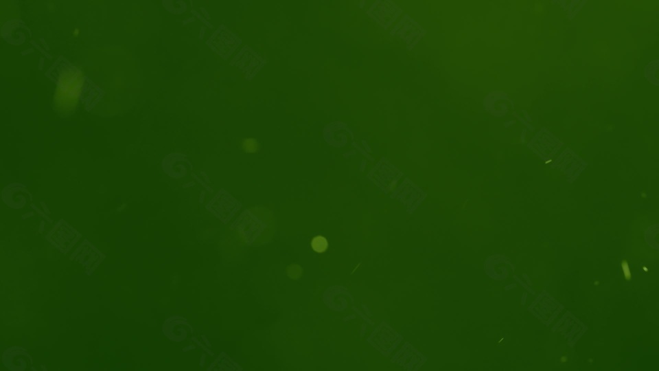 白色的旋转粒子在绿色背景下